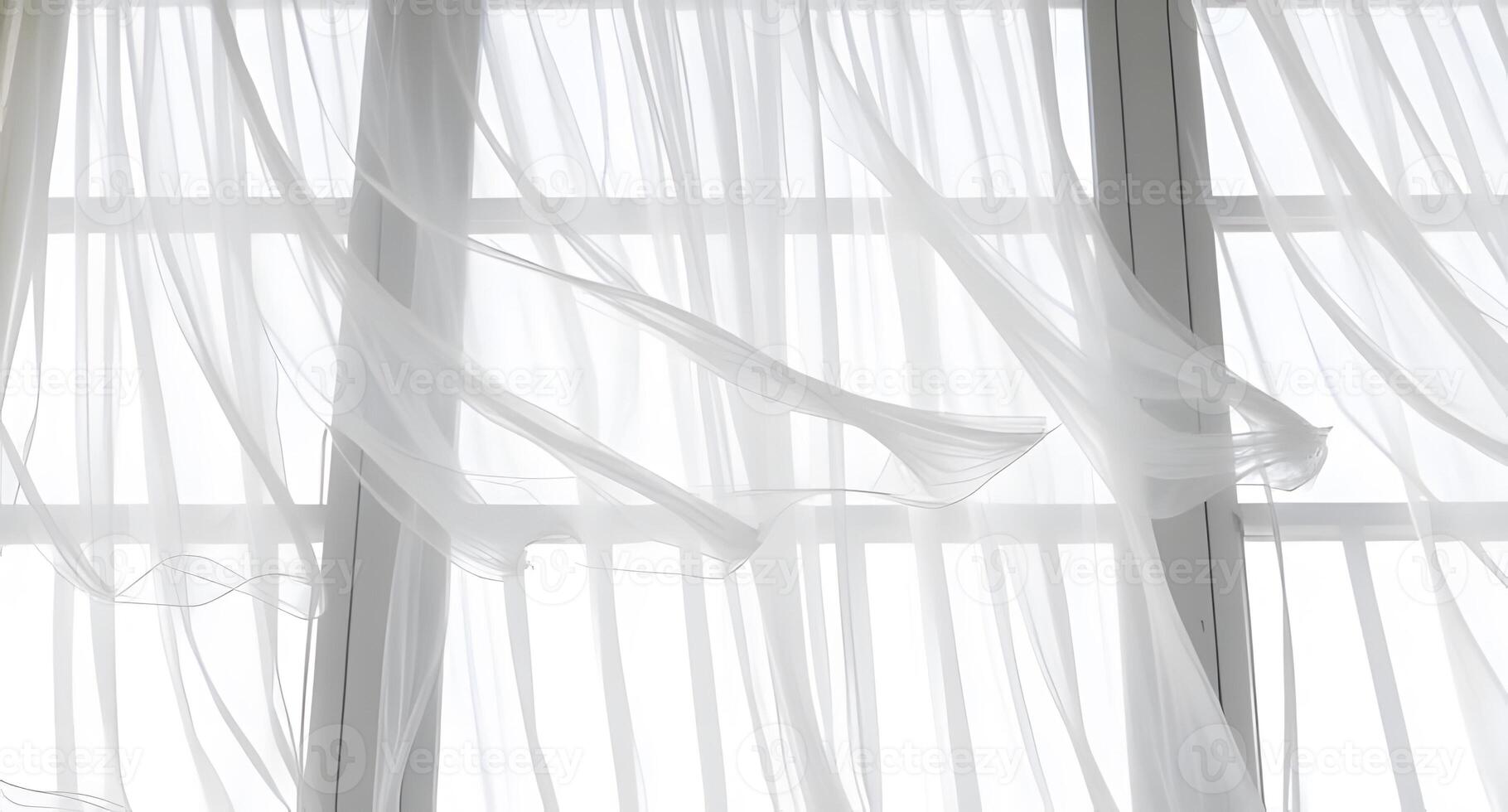 A window with white curtains and a curtain rod photo