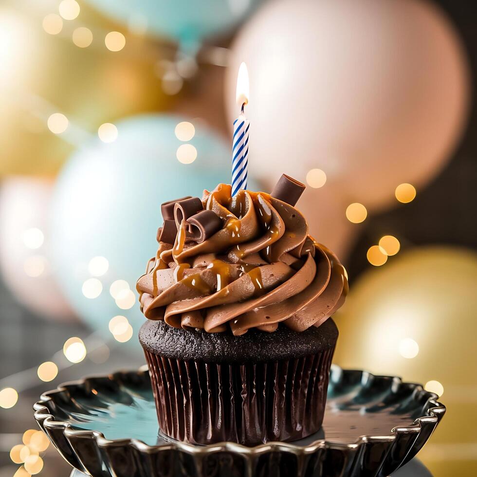 A chocolate cupcake with a single candle on top photo