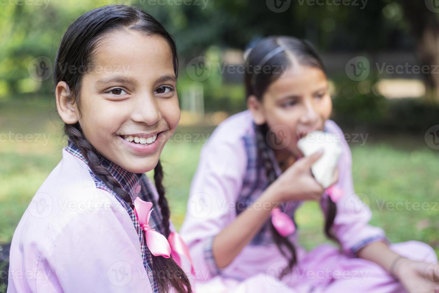 Three Girl Friends Are Smiling And Looking Back At The Camera photo