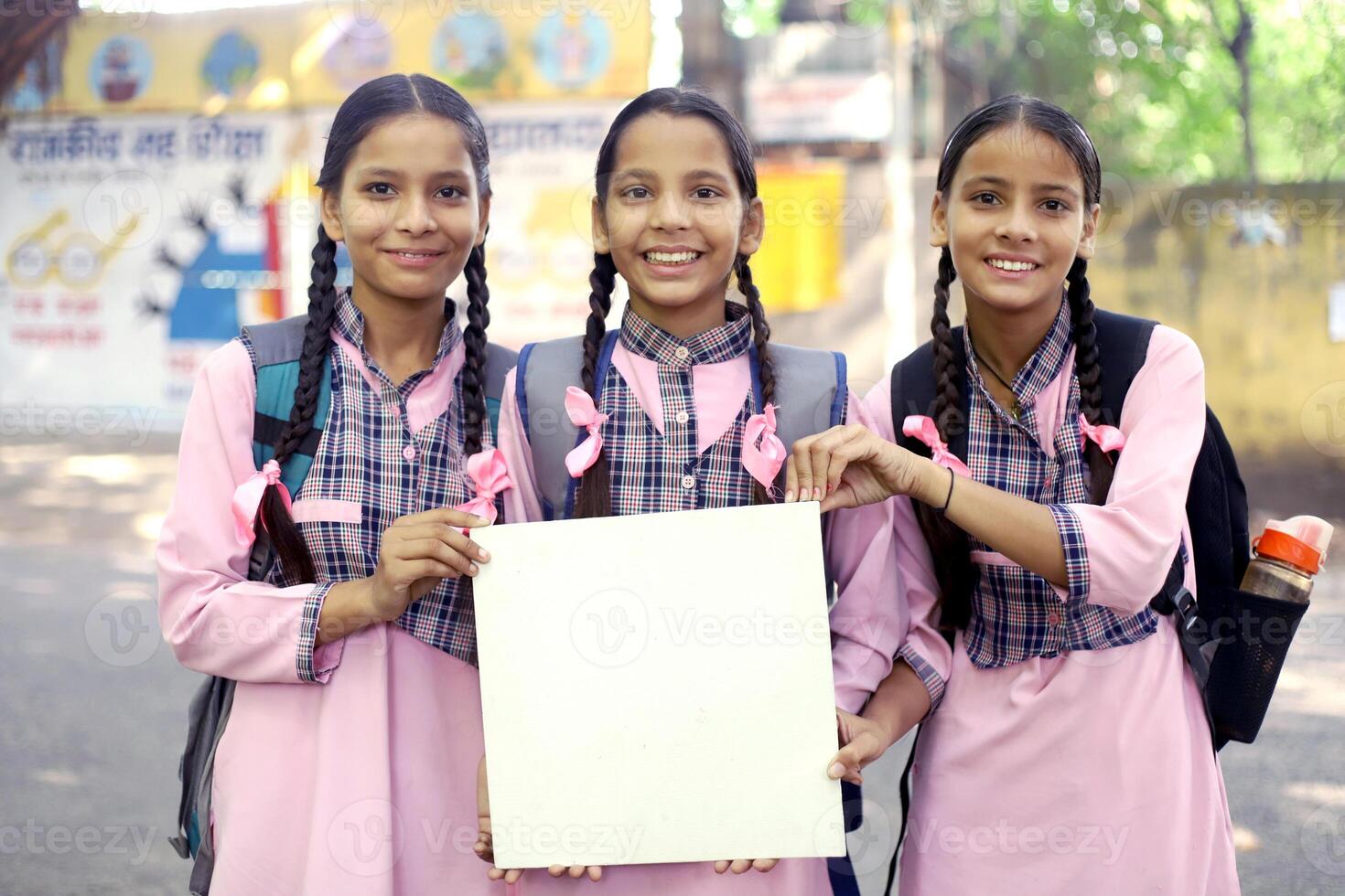 Three Smart Students Going In An Auto Rickshaw To School photo