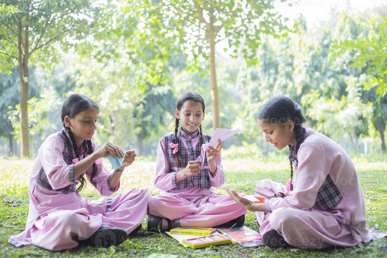 Two Girl Young Mates Prepare For Exams In The Park photo