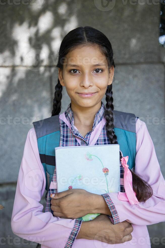 School Friends Smiling Showing Whiteboard In Front Of The Camera photo