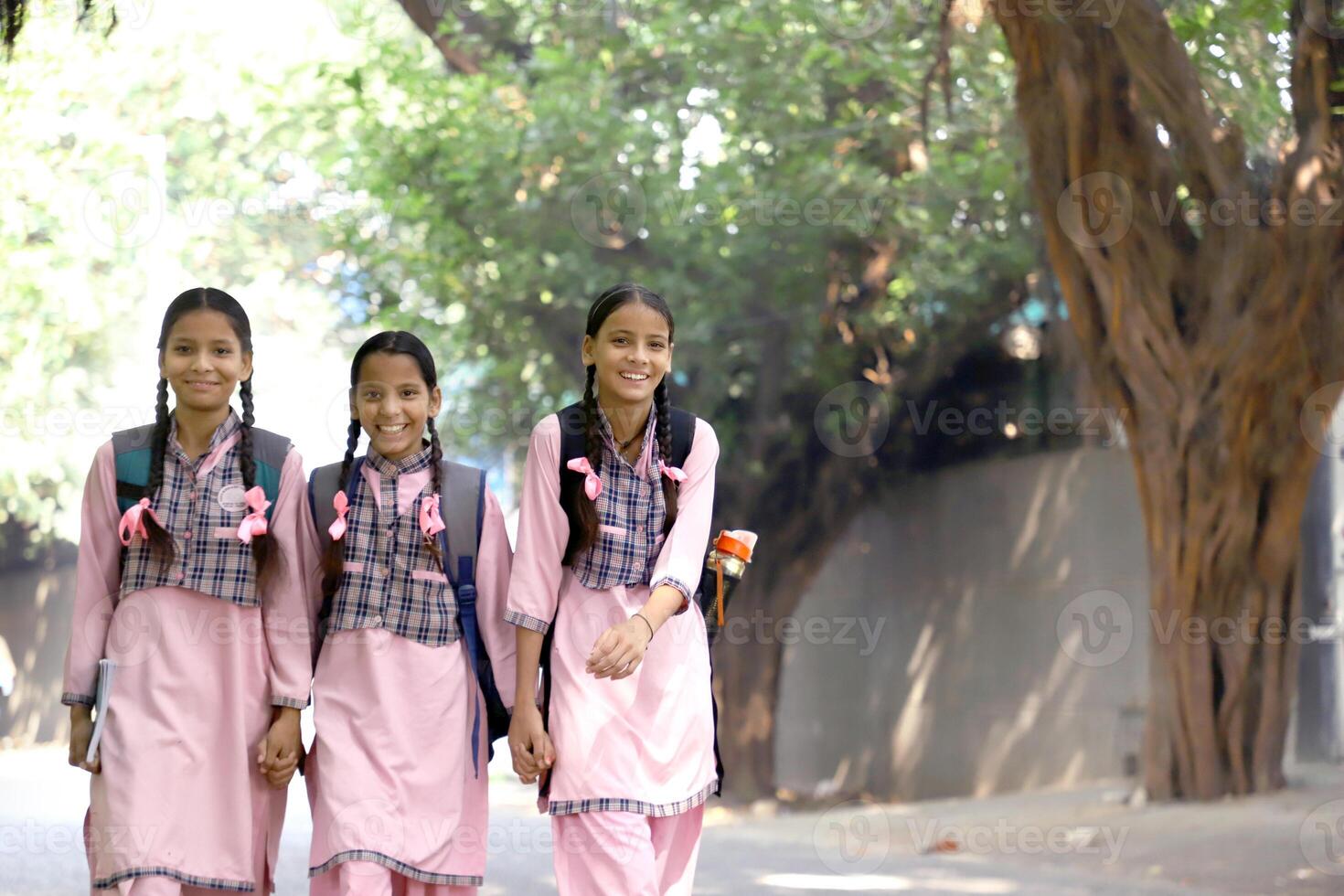 A Secondary Girl Student Making A Pose In Front Of The Camera While Holding Bag photo