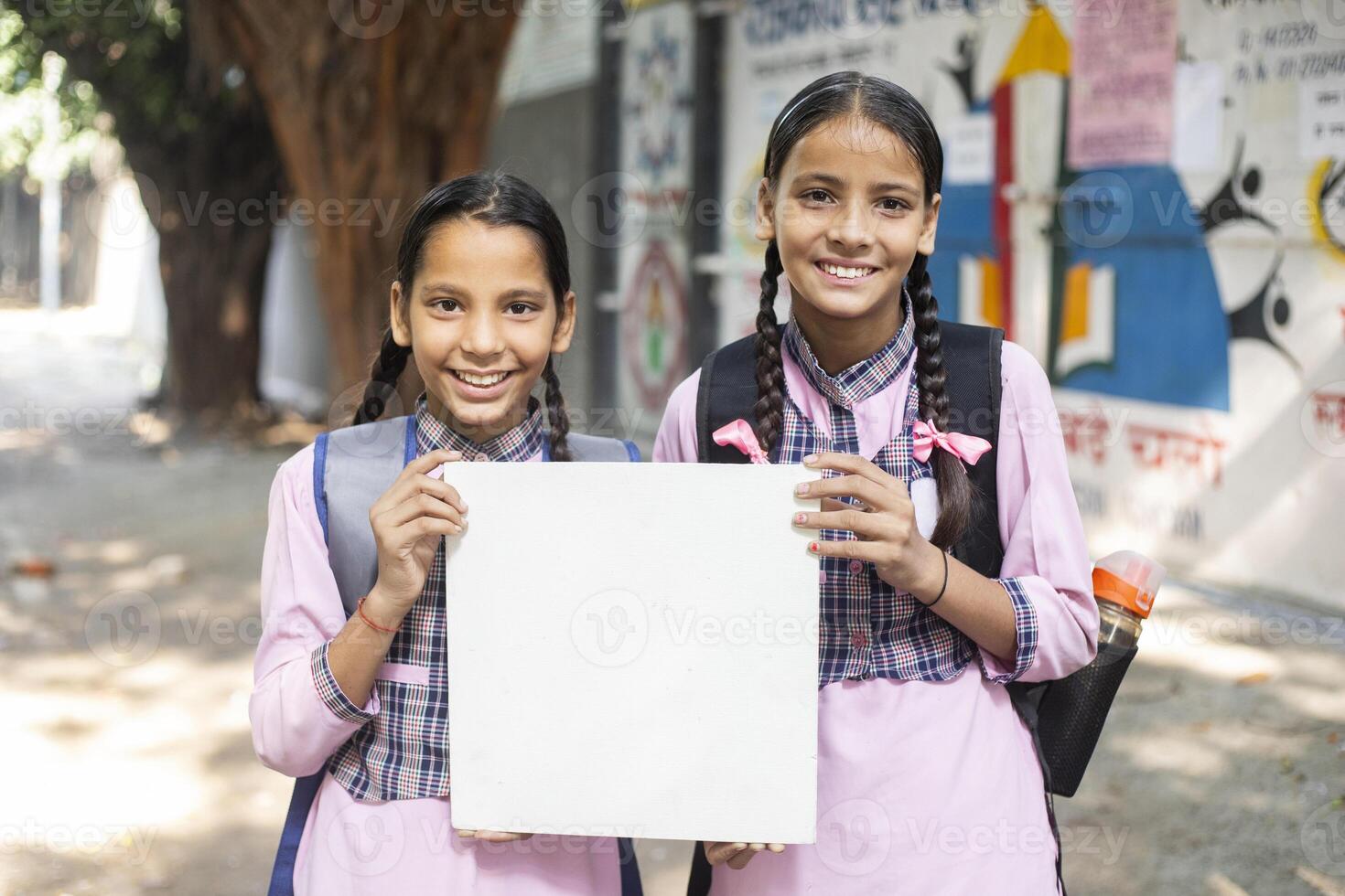 Cute Girl Best Friends Sitting At The School Park And Eating Lunch photo