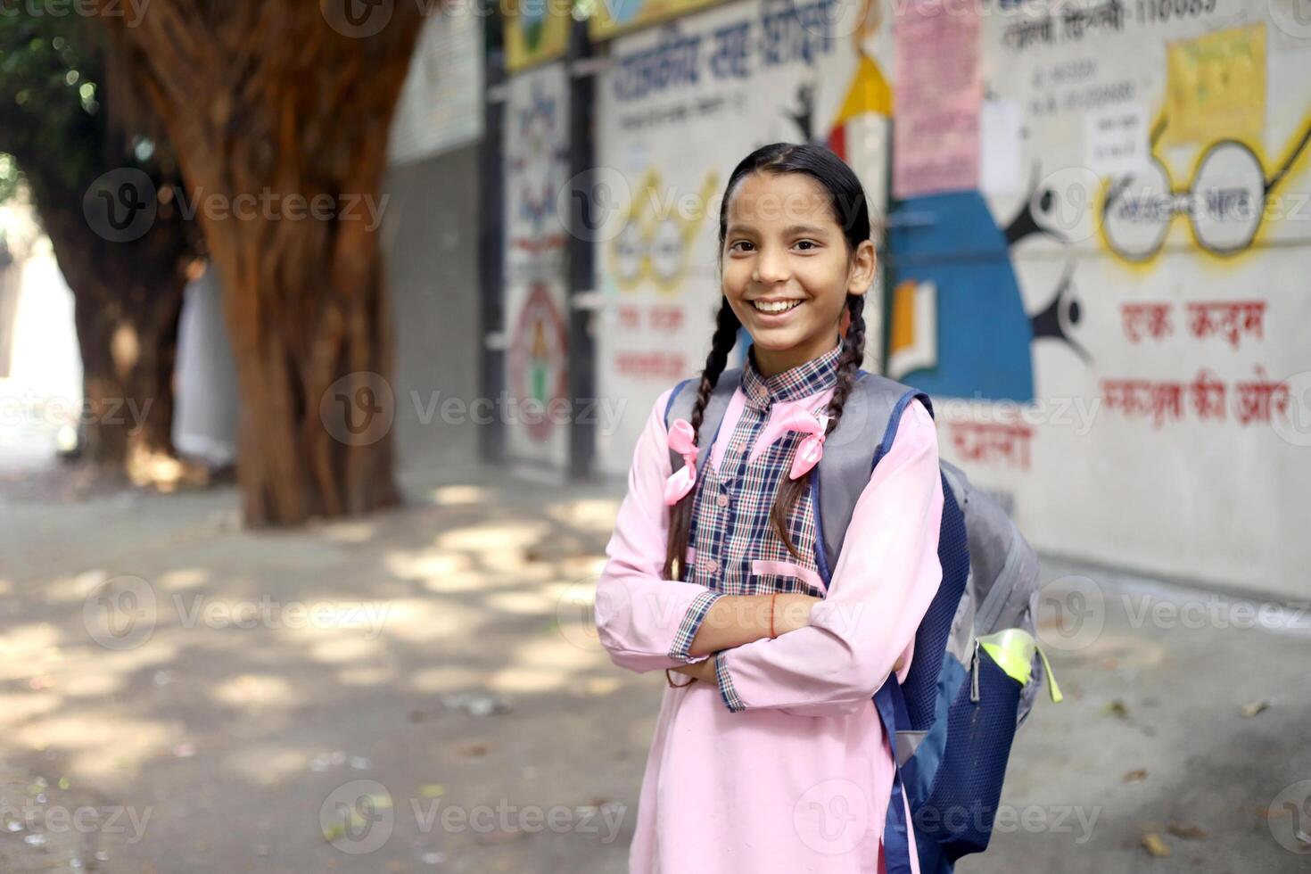 Rural Area Girl Students Showing Black Slate In Front Of The Camera photo