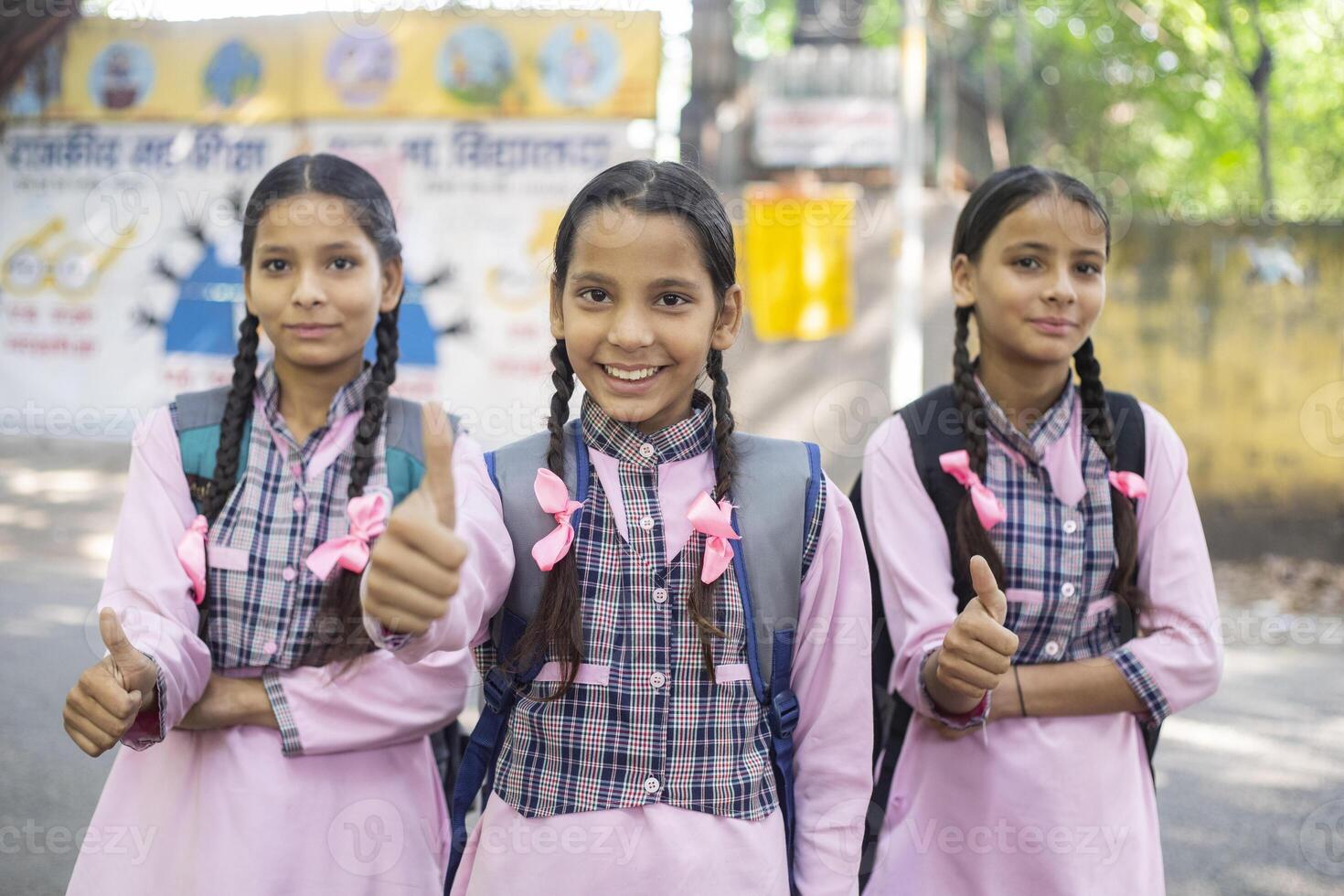 Rural Girl Smiling While Standing Outside The School photo
