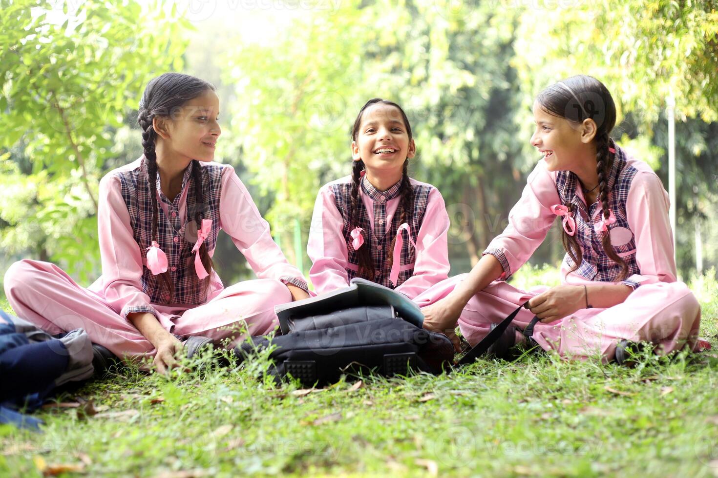 Indian Girl Child Showing A Thumbs Up Gesture in the park photo