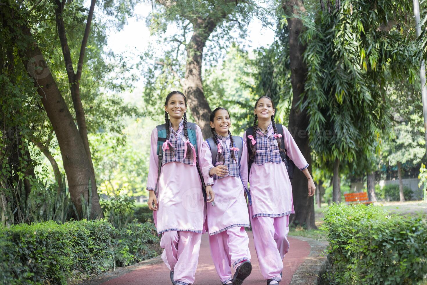 Photoshoot Of Rural One Student Girl In School Dress Standing With Backpack Smiling While Looking At The Camera photo