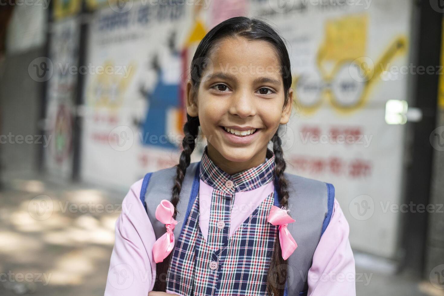 Cute Kid Standing While Holding Slate In Hand With Written Text ''Back To School'' photo