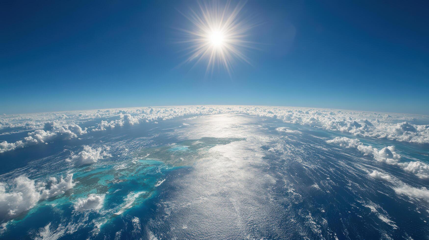 The sun shines over the earth and the clouds photo