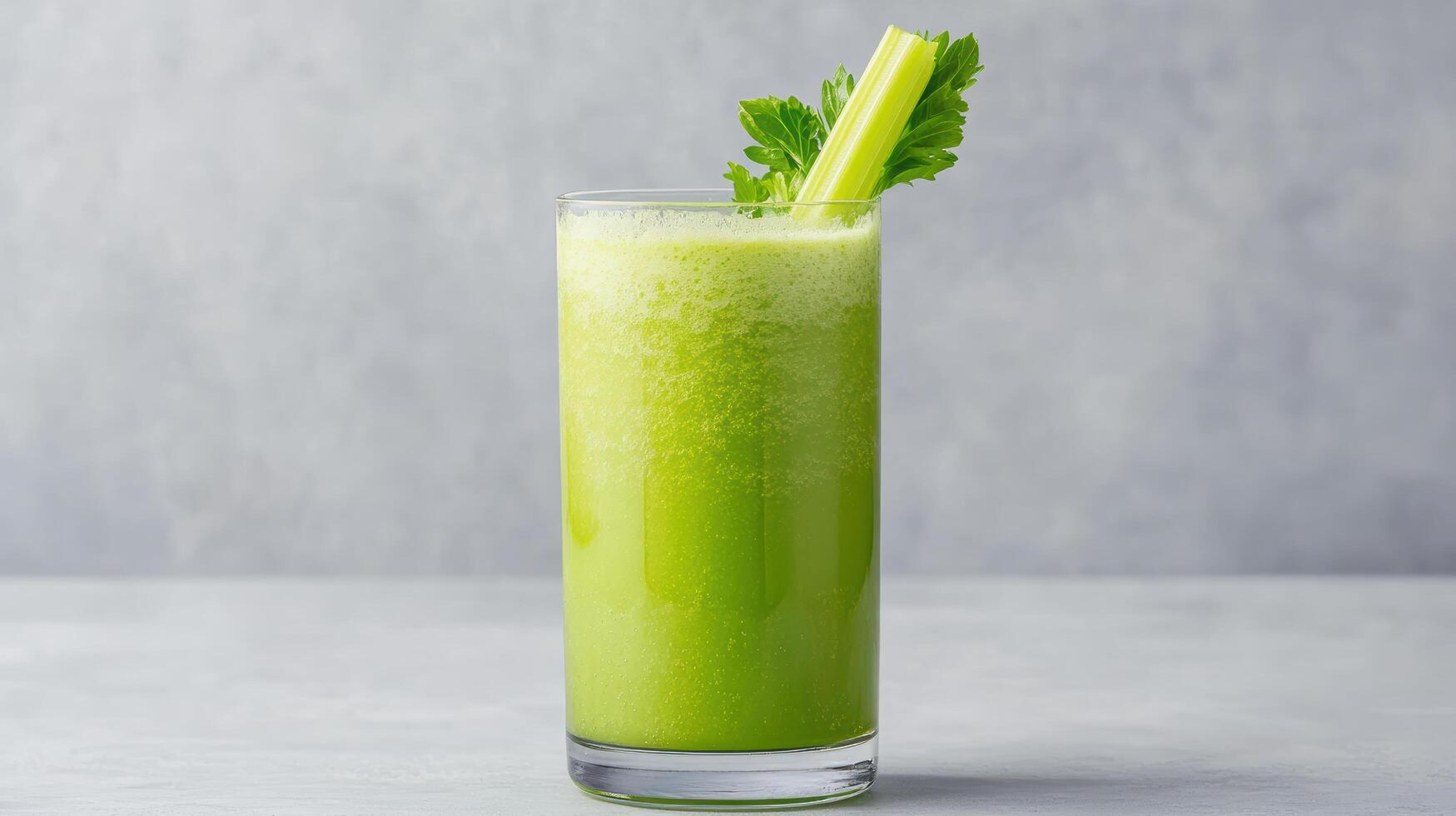 A green drink with celery in it photo