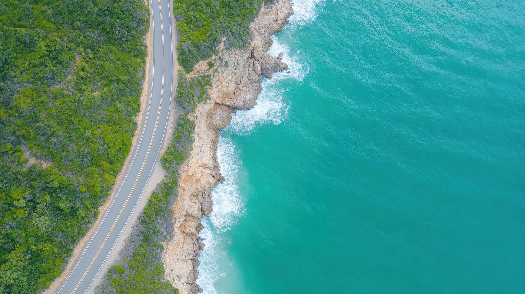 Aerial view of road on the coast of the ocean photo