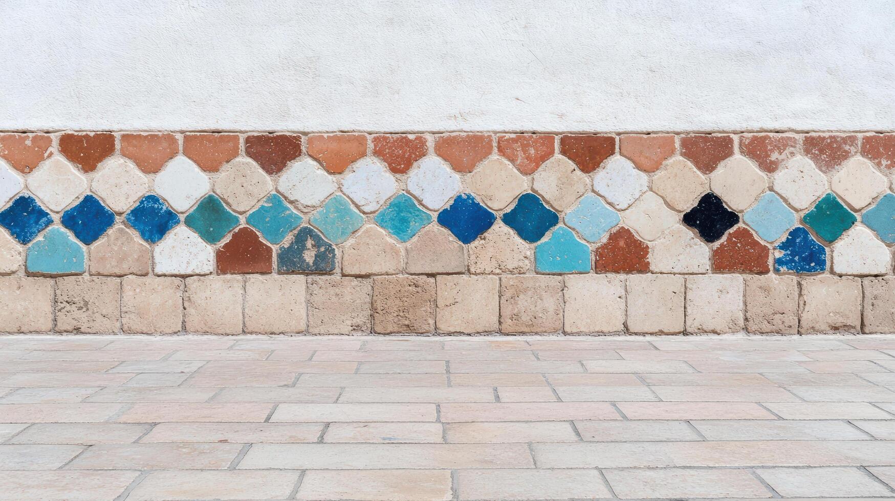 Colorful tiles on a wall in a courtyard photo