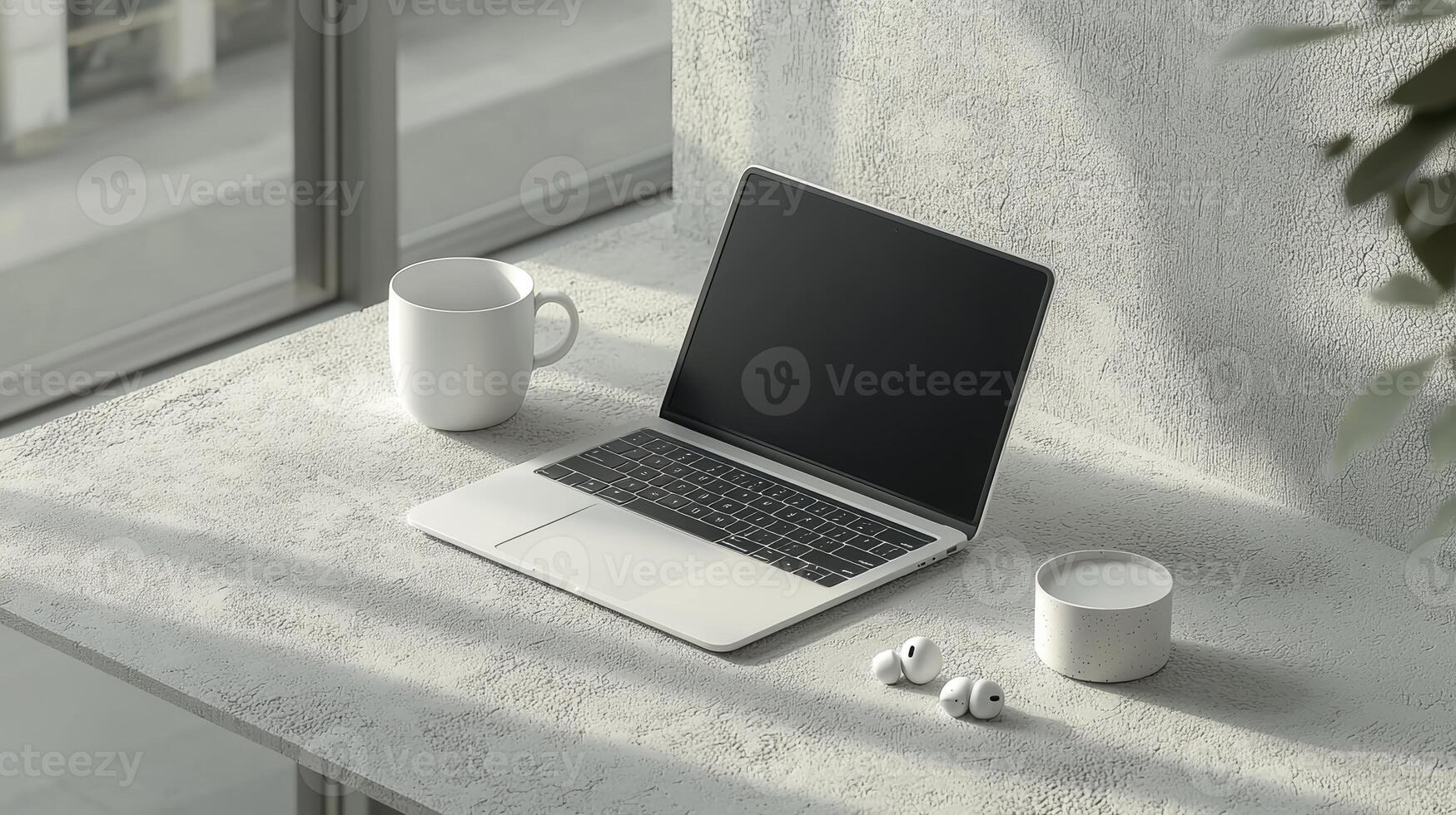 Laptop on a table with coffee and mug photo