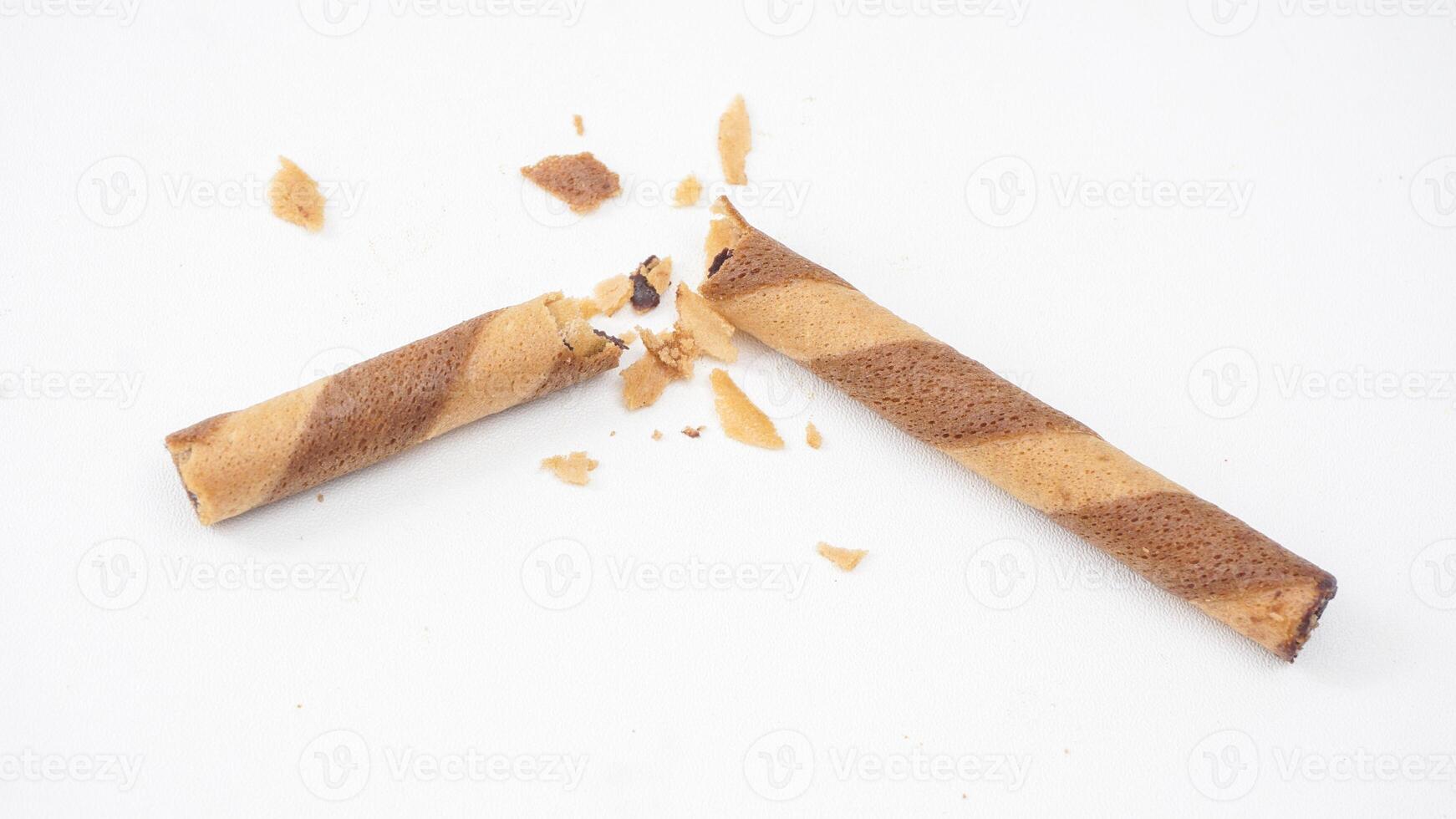 Cocoa filled wafer rolls with a crispy texture isolated on white background photo