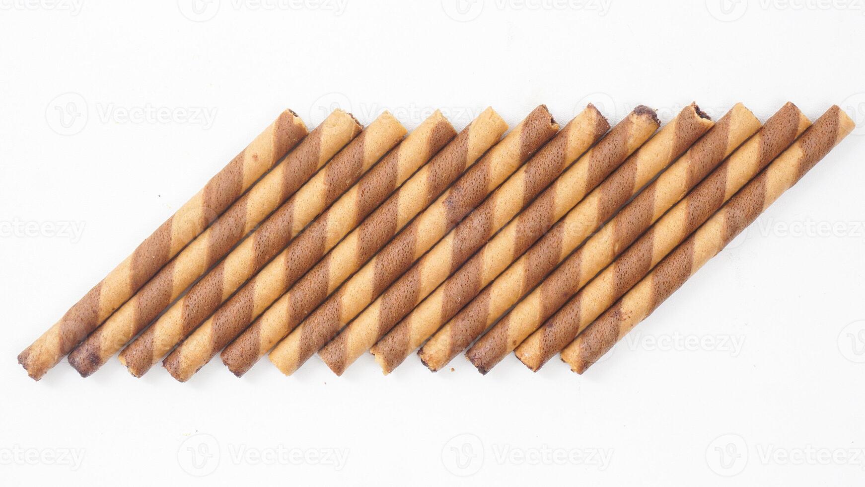 Chocolate flavored wafer rolls with a delicate crunch isolated on white background photo