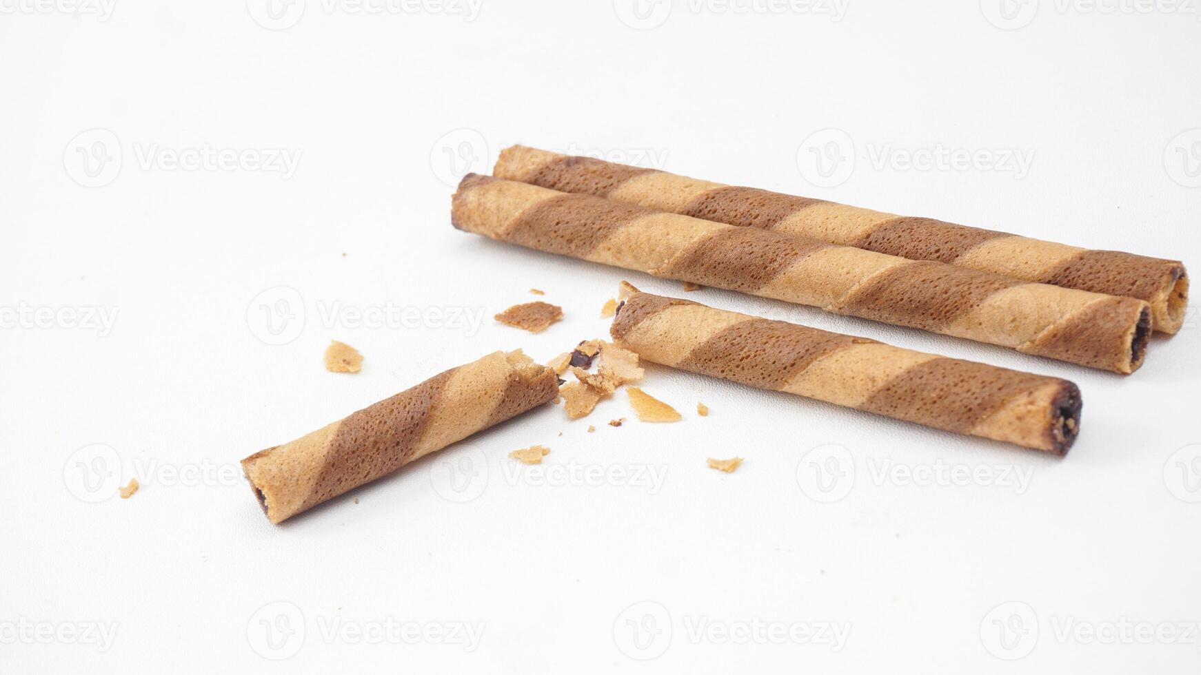 Chocolate coated wafer rolls with a crispy crunch isolated on white background photo