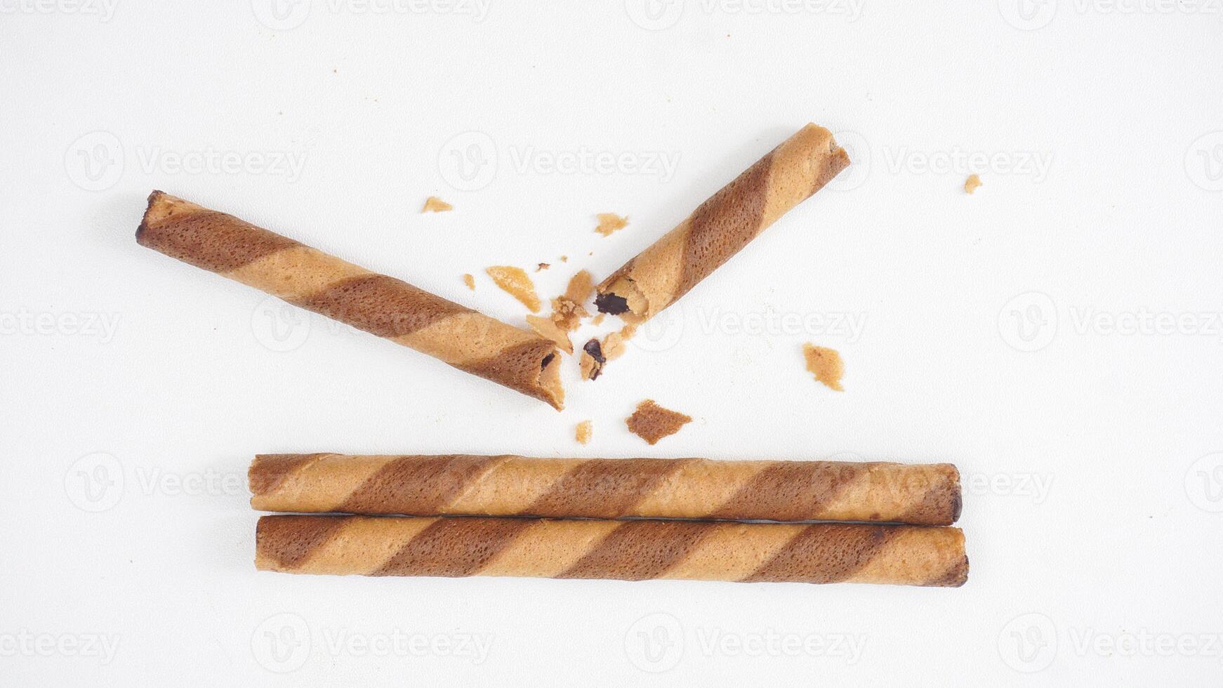 Sweet wafer rolls with rich chocolate filling isolated on white background photo