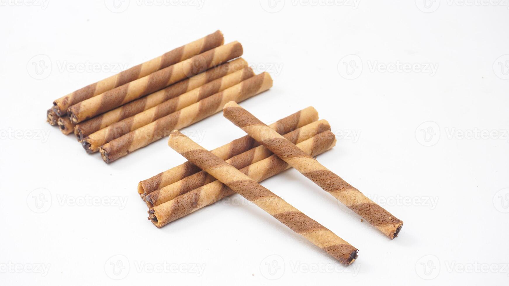 Chocolate swirled wafer rolls with rich cocoa flavor isolated on white background photo