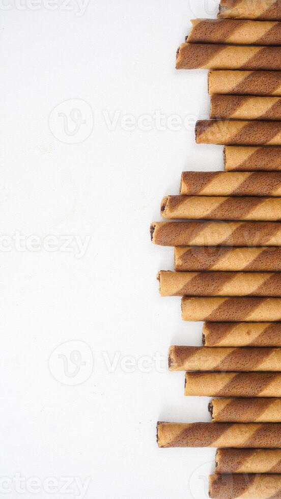 Traditional European style chocolate wafer rolls isolated on white background photo