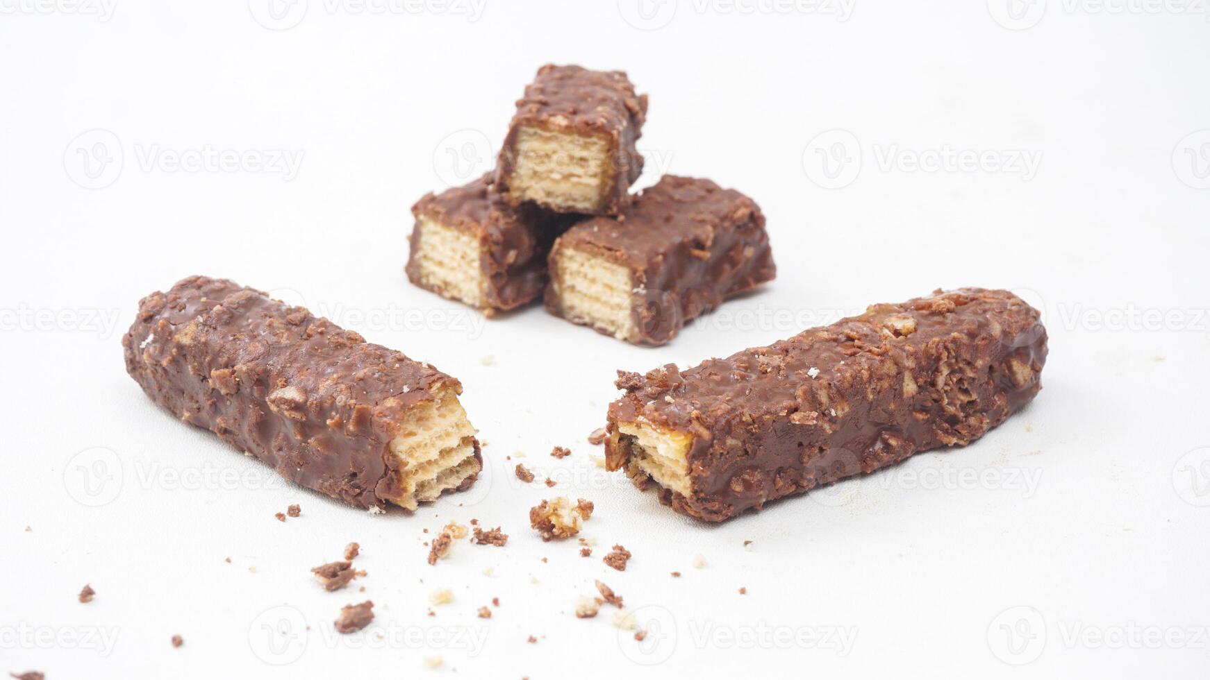 Classic chocolate covered wafer bars with caramel and puffed rice crisps isolated on white background photo