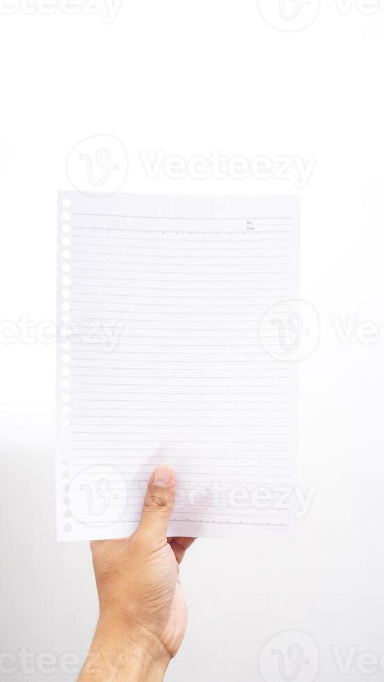 Hand holding white stripped paper isolated on white background photo