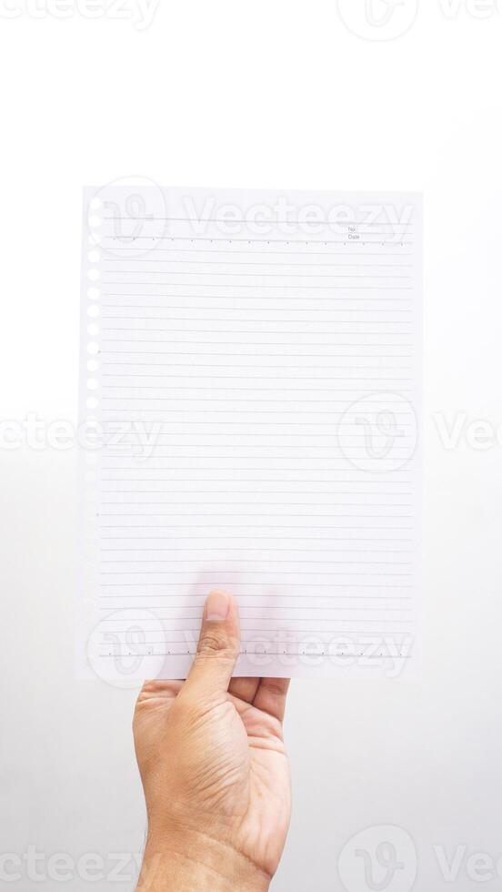 Hand holding stripped paper isolated on white background photo