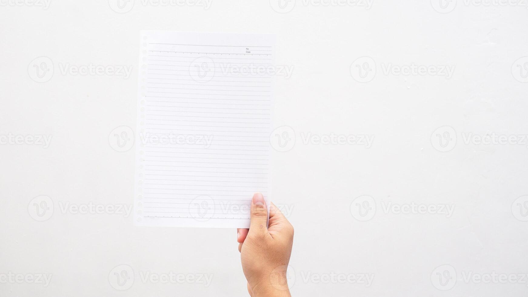 Stripped paper held by hand isolated on white background photo