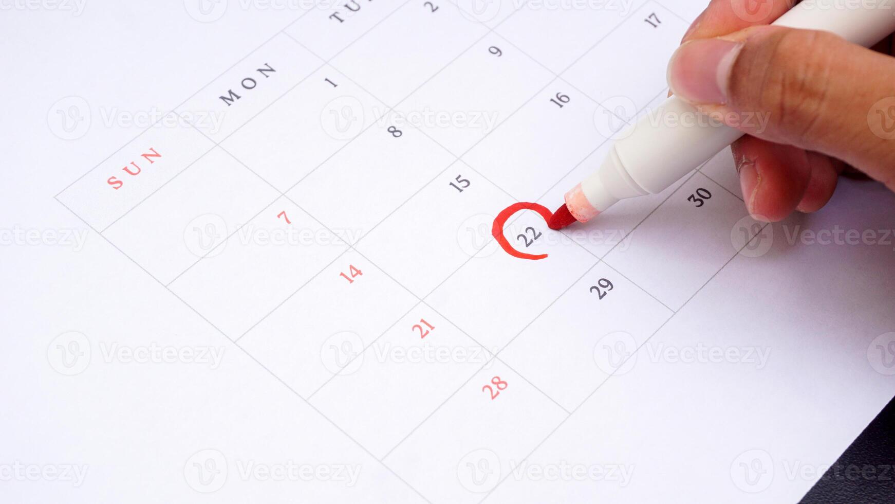 Red circle marked on a calendar at 22 photo