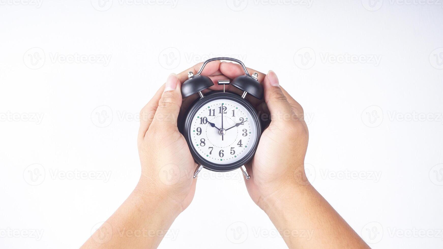 Classic design of black alarm clock isolated on white background photo