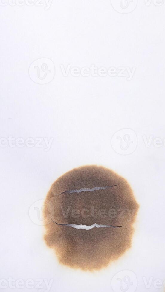 Burnt white paper isolated on white background photo
