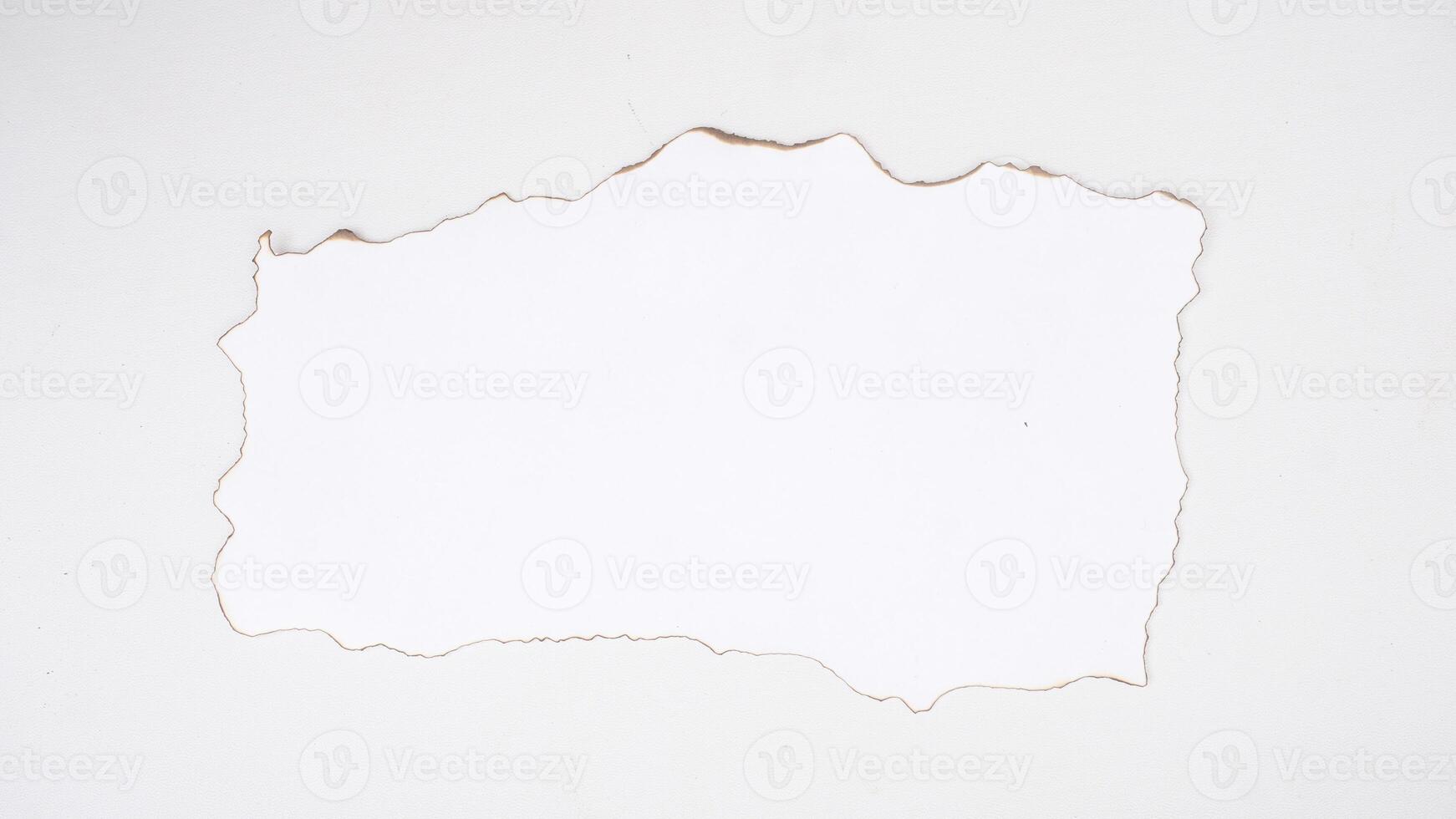 White paper with burnt edges isolated on white background with clipping path photo