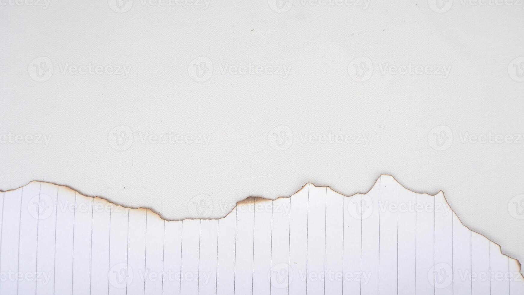 White stripped paper with burnt edges on a white background for copy space photo