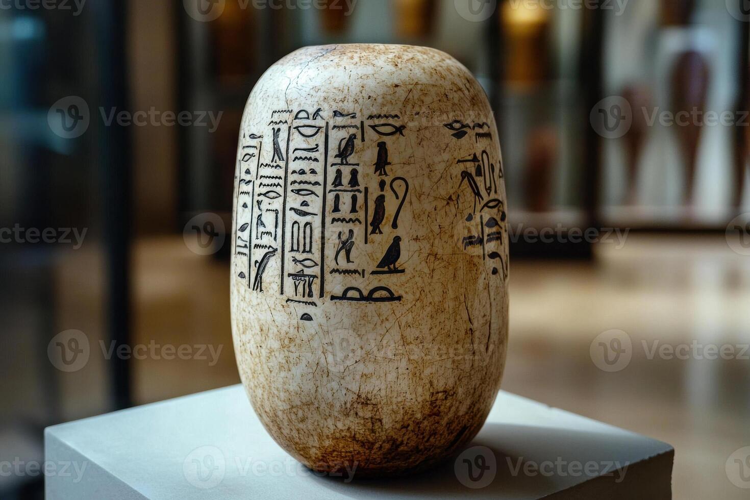 Ancient Egyptian canopic jar with hieroglyphs photo