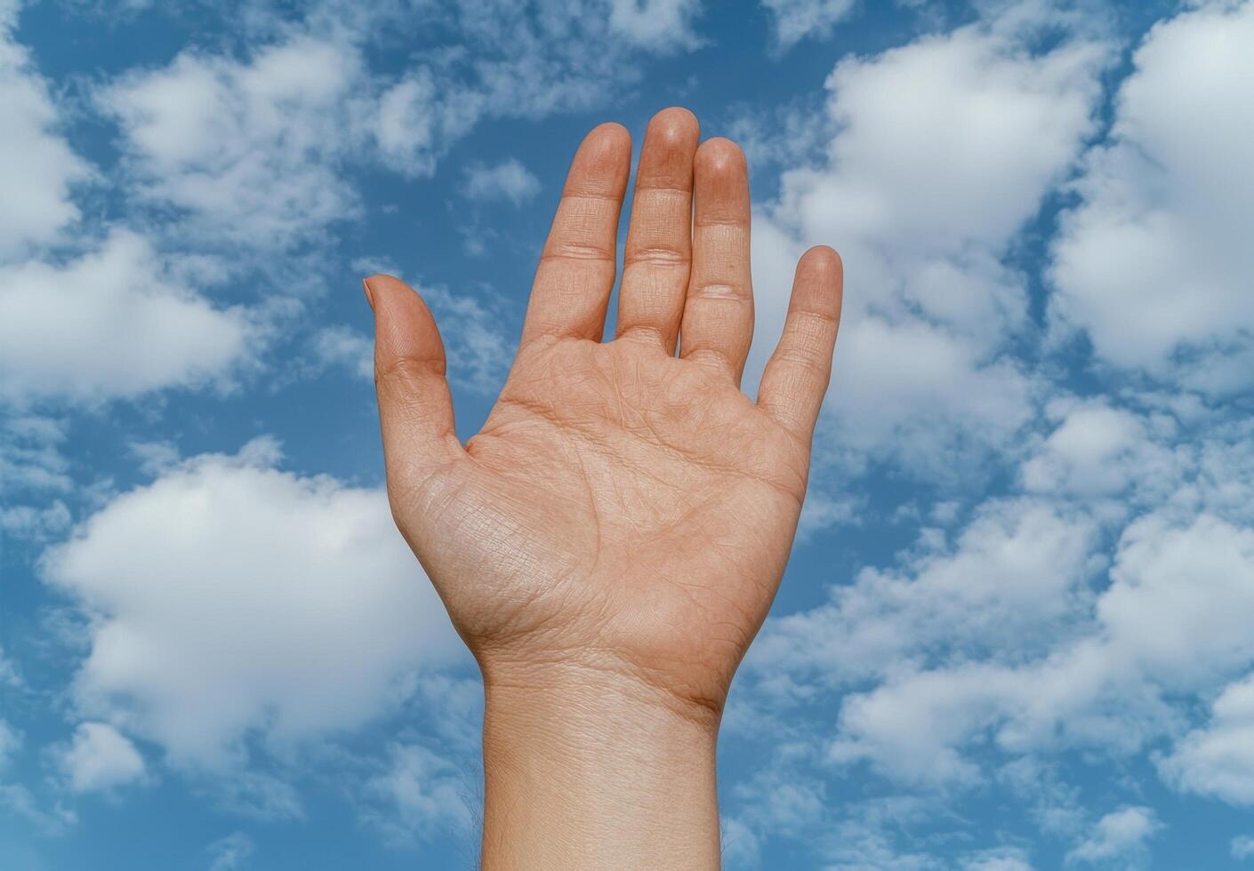 Hand reaching towards the sky. photo