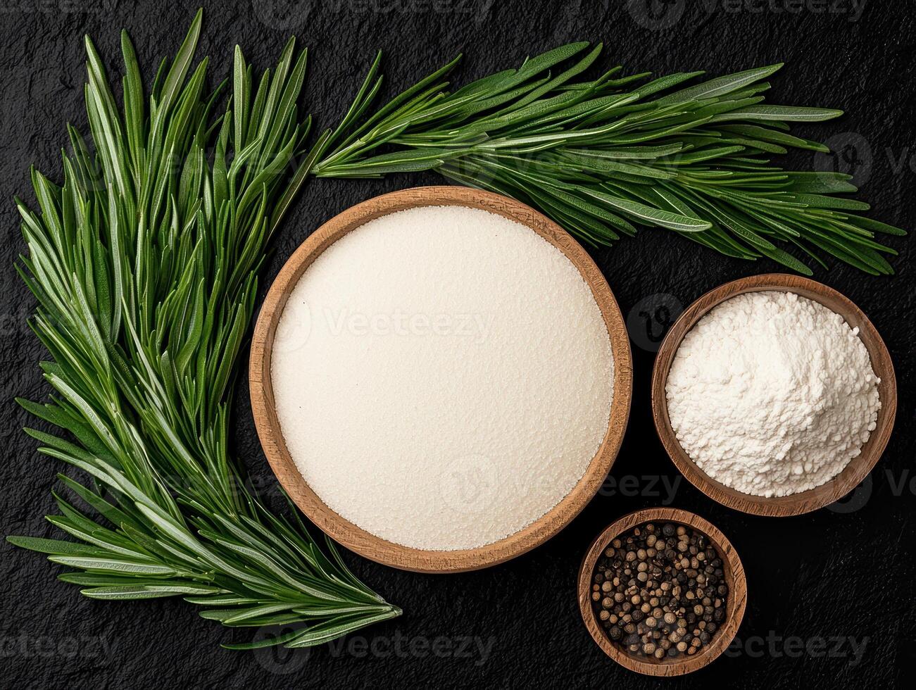 Overhead shot of ingredients including flour, semolina, peppercorns, and rosemary photo