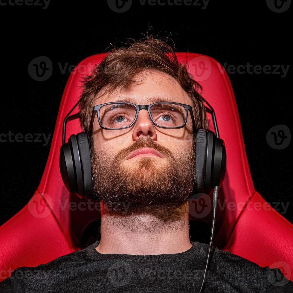 Immersed in web of sound, this individual enjoys streaming on platform designed for gamers, showcasing focus and concentration photo