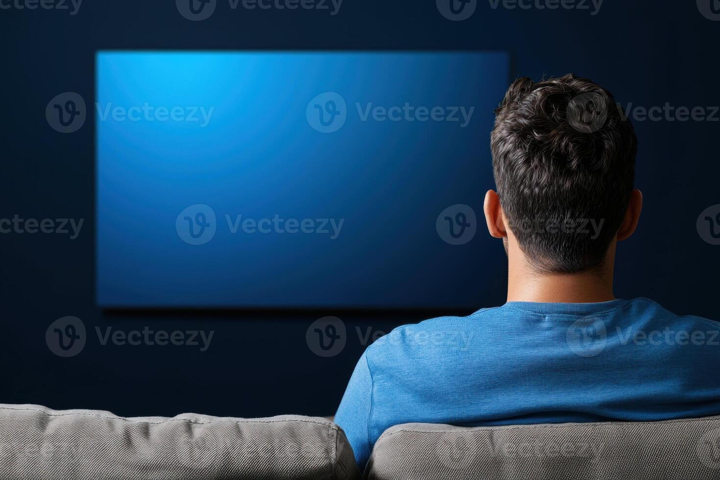 person enjoys relaxing moment on couch while watching blank screen on modern television, perfect for streaming content on web platform photo