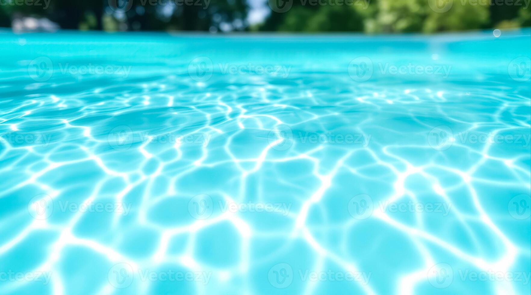 abstract of sunlight on the surface of a turquoise swimming pool photo