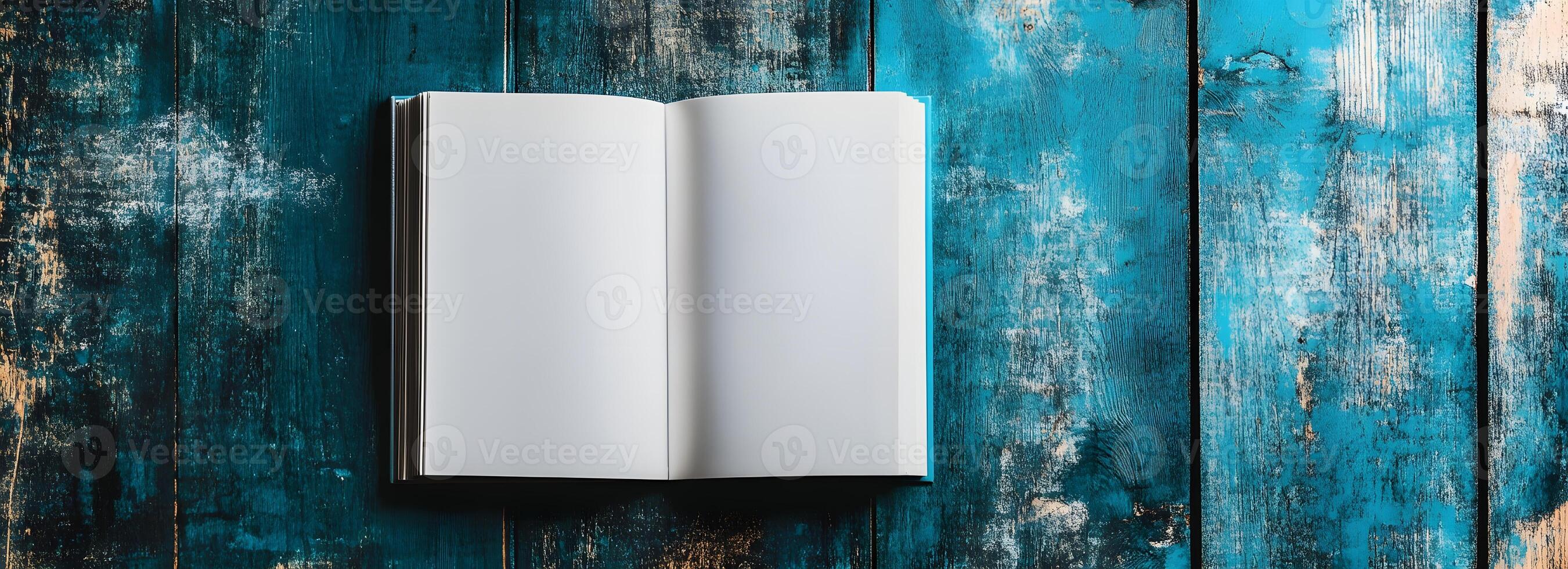 Vintage Open Book on Weathered Wooden Texture Background photo