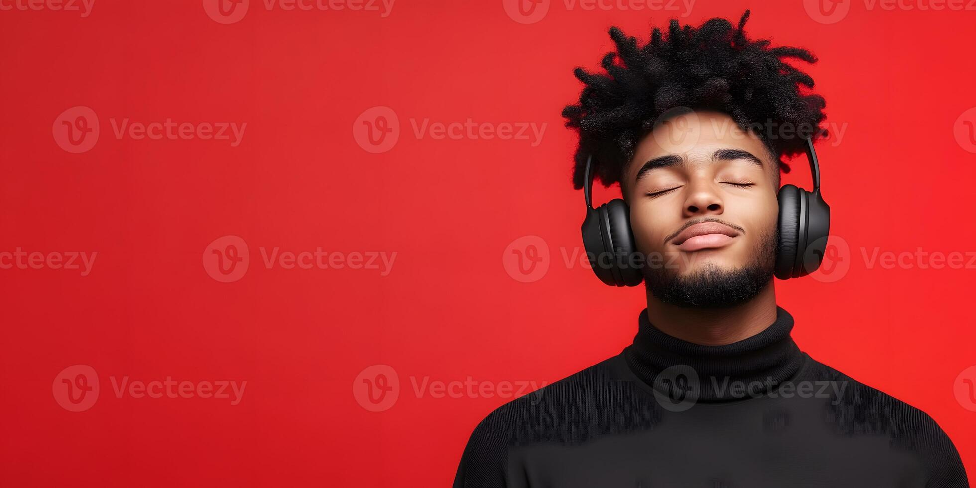 Relaxed Young Man Enjoying Music with Headphones on Red Background photo