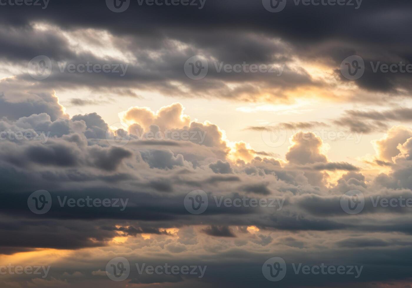 Dramatic sunset sky with layers of fluffy clouds creating a heavenly atmosphere. photo