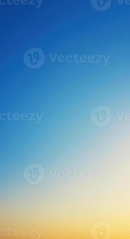 A calming gradient background merging serene blues with warm yellows, ideal for any design. photo