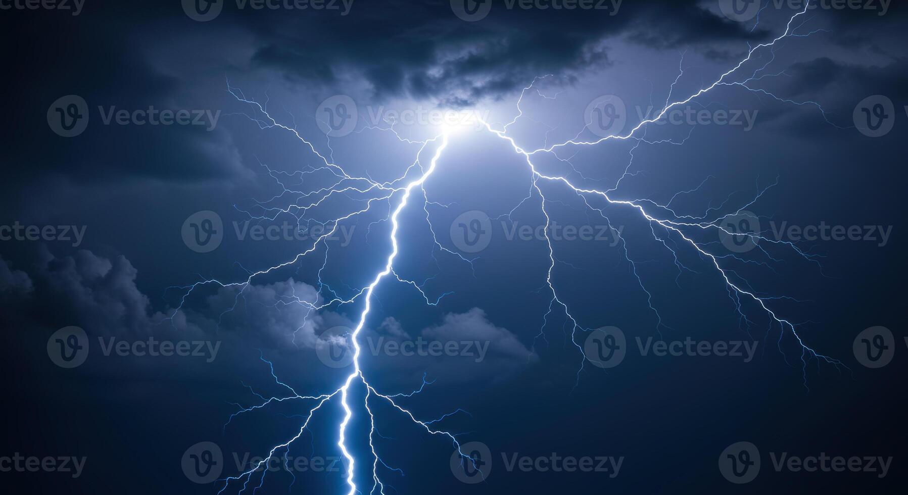 A brilliant lightning bolt pierces through the heavy clouds during a fierce thunderstorm. photo