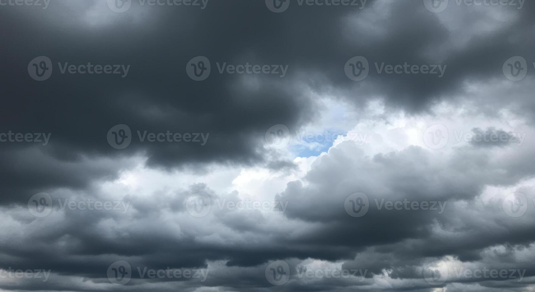 Storm clouds gather in a dramatic sky, creating a breathtaking cloudscape. photo