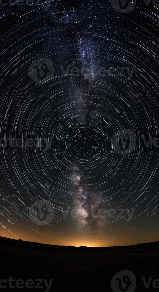 Magnificent star trails create a mesmerizing spiral around the night sky's center point. photo