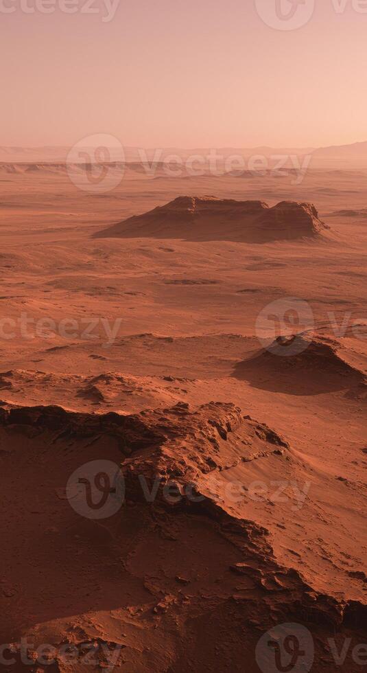 A panoramic view of a desolate, rocky martian landscape under a hazy, expansive sky. photo