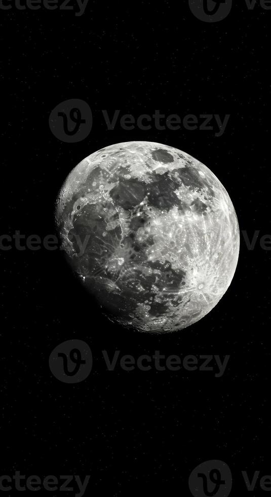 A detailed view of the moon, showcasing its craters and textures against the starlit night. photo