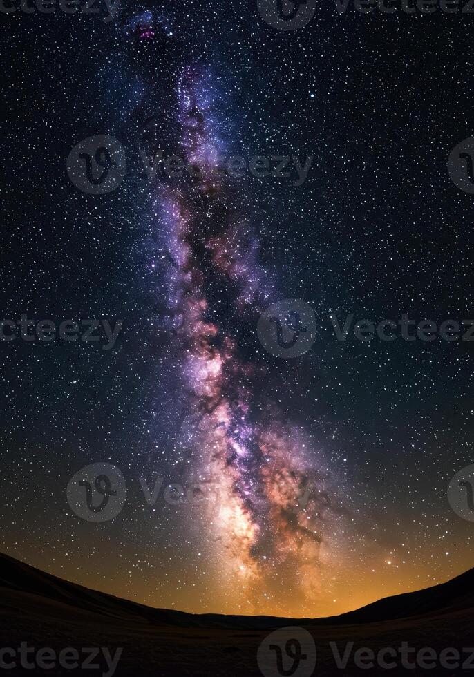 Spectacular view of the milky way stretching across the dark night sky. photo