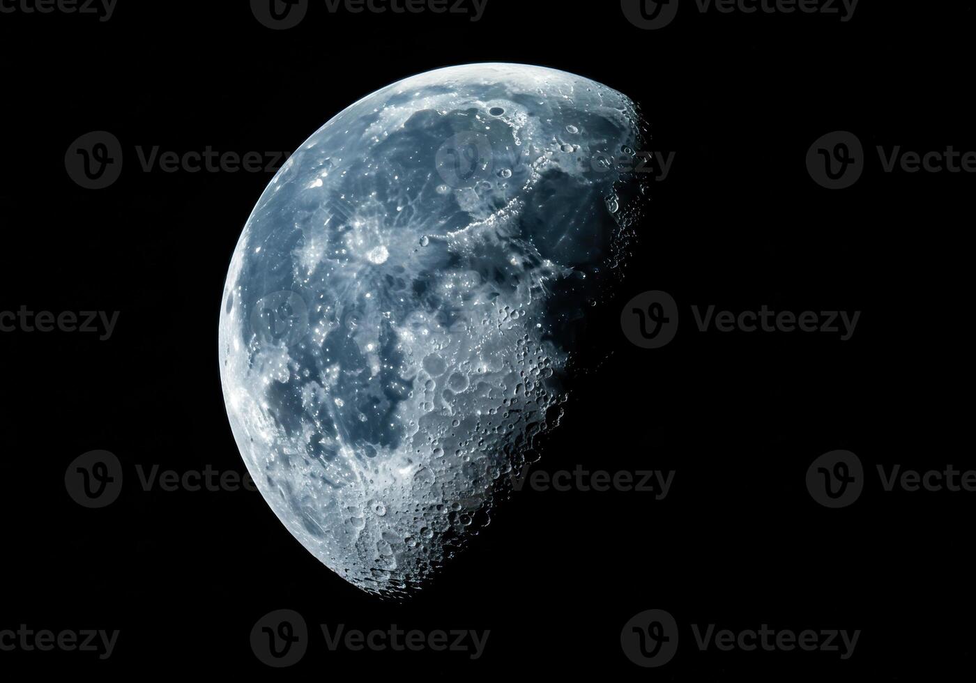 A detailed view of the moon's surface, revealing craters, and shadows in the vastness of space. photo